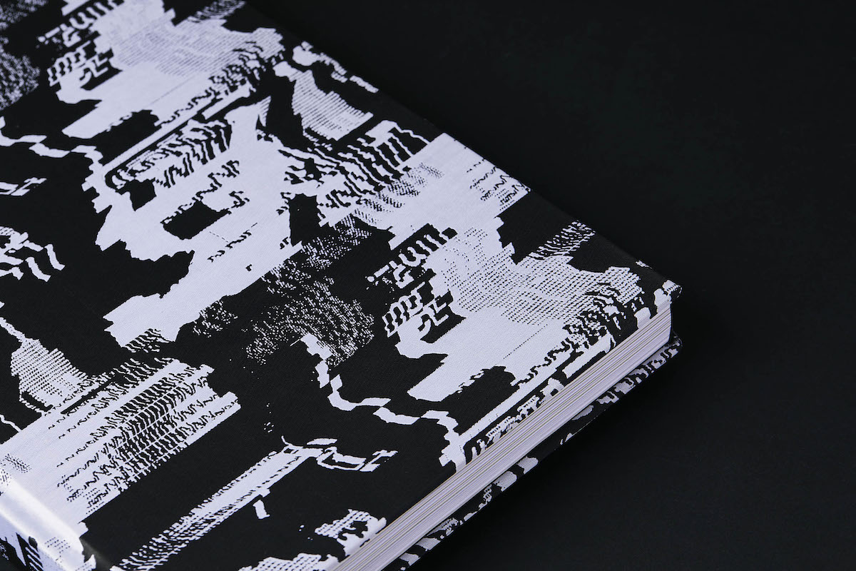 Pandemonium bound in jacquard fabric with typographic print
