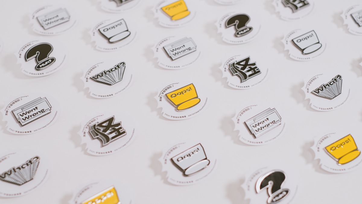 'Oops! The fonts went wrong...' exhibition pin badges 
